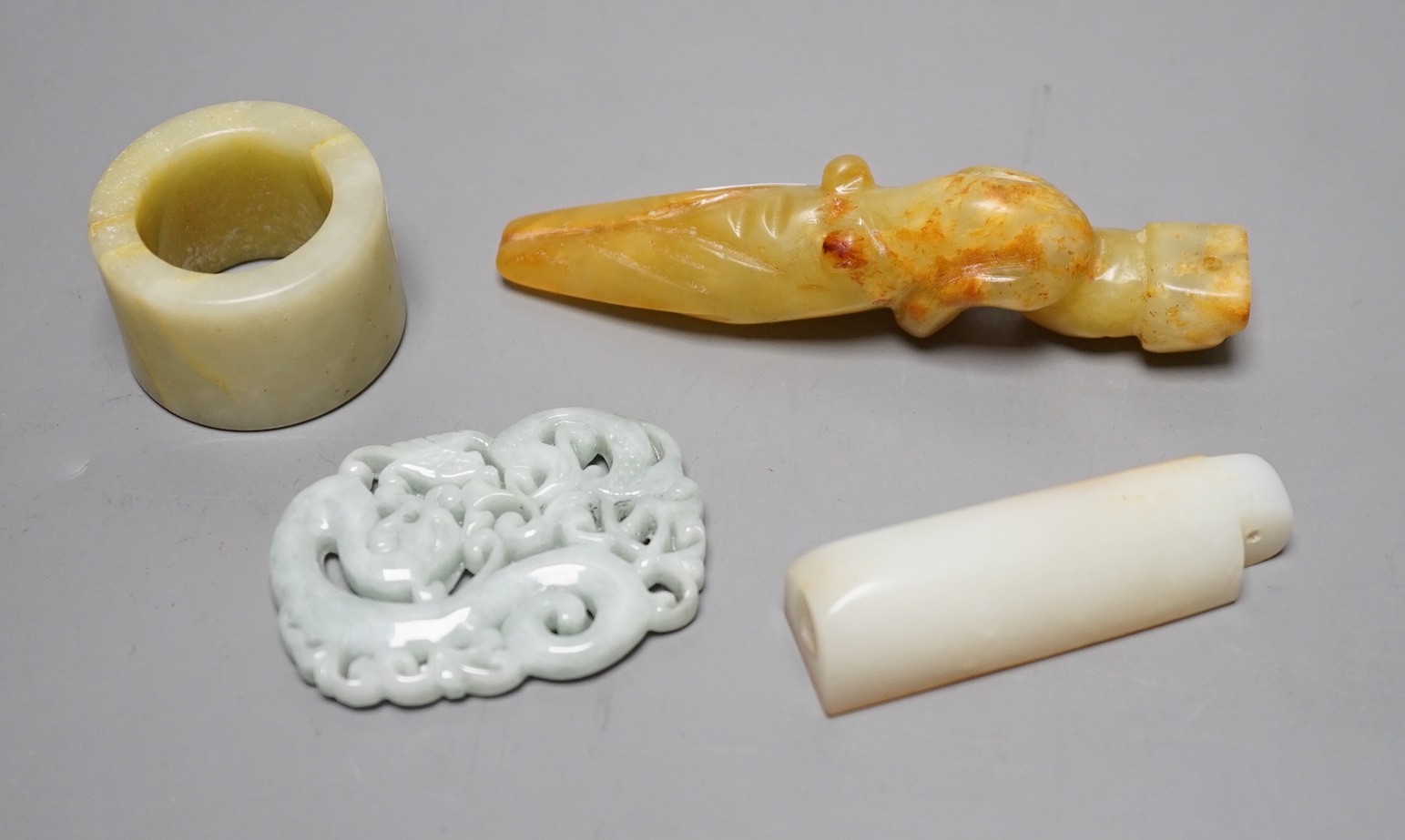 Four Chinese jade or hardstone carvings and figures, largest 9cm long